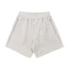 Ribbed-waistband athletic shorts with side pockets and a zipper