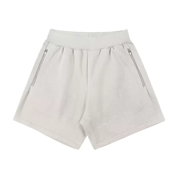 Ribbed-waistband athletic shorts with side pockets and a zipper