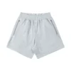 Ribbed-waistband athletic shorts with side pockets and a zipper